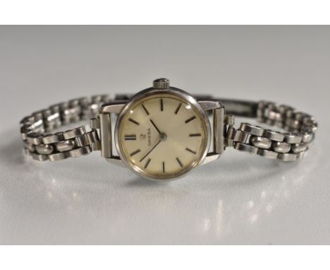 Omega - a lady's bracelet watch, silvered dial, block baton markers, manual wind Cal 620 movement, serial No 22558033, stainl