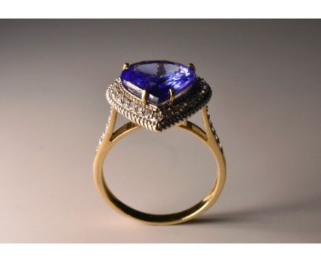 A Gemporia Lorique collection diamond and blue stone teardrop cluster ring, central vibrant purply blue teardrop stone possib