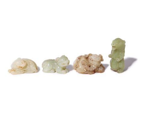FOUR JADE CARVINGS OF MYTHICAL BEASTS AND ANIMALS
Including an elephant; and two Buddhist lions
The largest 6.5cm long
Condit