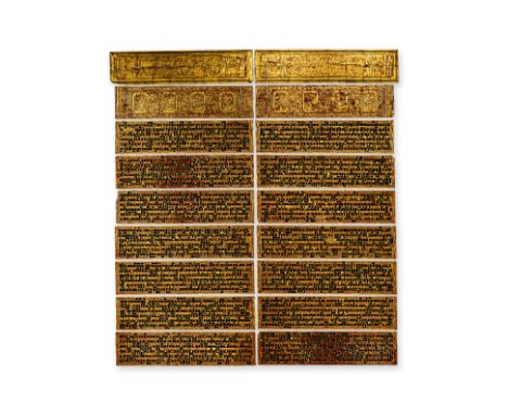 A BURMESE GILT LACQUER KAMMAVACA BUDDHIST MANUSCRIPT
Consisting of two wood covers and sixteen leaves, decorated with black t