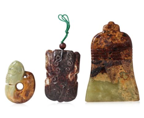 A GROUP OF THREE ARCHAISTIC STYLE JADE PENDANTS Comprising: a green and russet jade pig dragon pendant; a bell-shaped pendant