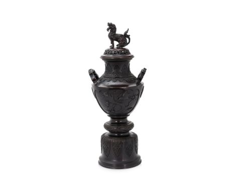 A LARGE JAPANESE BRONZE TWIN HANDLED KORO AND COVER
Early 20th Century, the pierced cover with mythical beast finial (detache