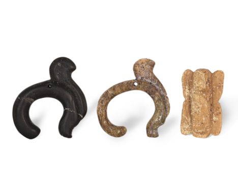 THREE JADE CARVINGS
Two of a similar Neolithic dragon shape and one other modelled as a bird
5.5cm to 6.2cm long
Condition: F