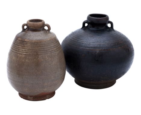 TWO THAI GLAZED BOTTLES
Sawankhalok, 15th Century, thickly potted globular squat shaped bottle with a wide belly, incised tur