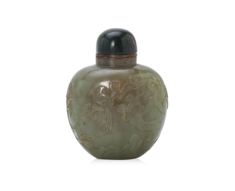 A JADE SNUFF BOTTLE Chinese, rounded body tapering toward lower, exterior carved in plum blossom and pheasant decoration, bra