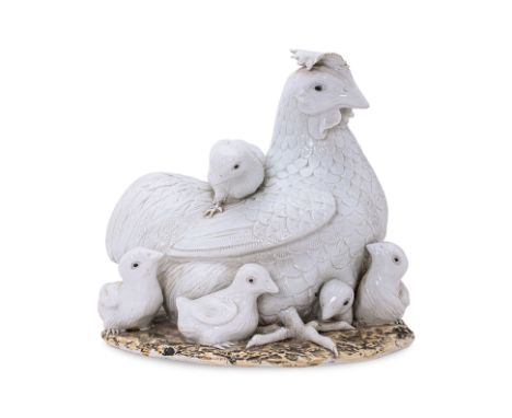 A BLANC DE CHINE PORCELAIN MODEL OF A HEN AND HER CHICKS
20th Century, naturalistically modelled, on oval plinth base, impres