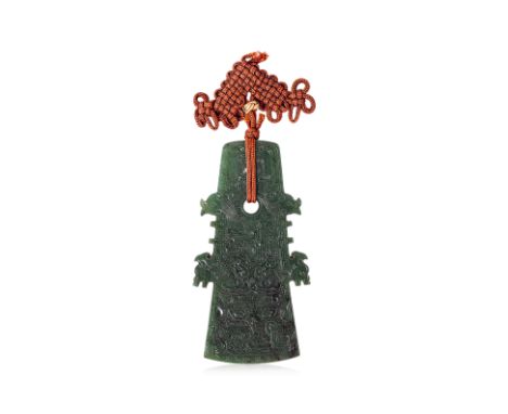 A SPINACH JADE PLAQUE PENDANT The pendant of archaistic axe head form carved in shallow relief with scrolls and mythical beas