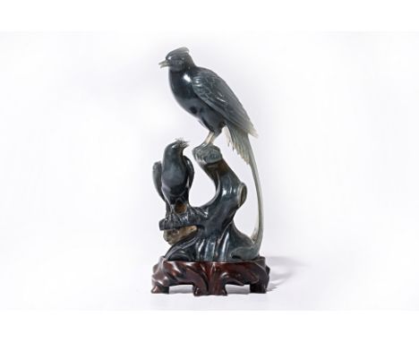 A JADE CARVING OF BIRDS
A pair of birds, with one perched on a tree branch while the other looks up from a lower branch, moun