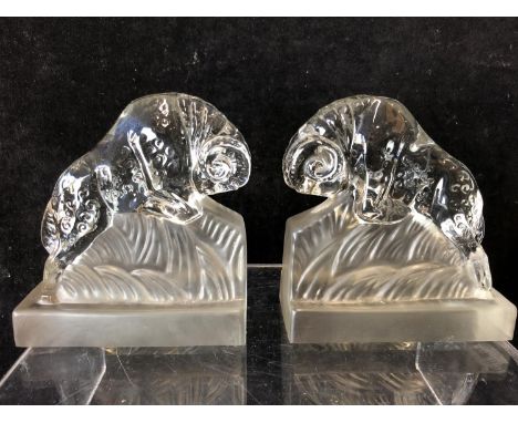A pair of Art Deco glass book ends modelled as charging rams, by the Libochovice glass company and after a design believed to