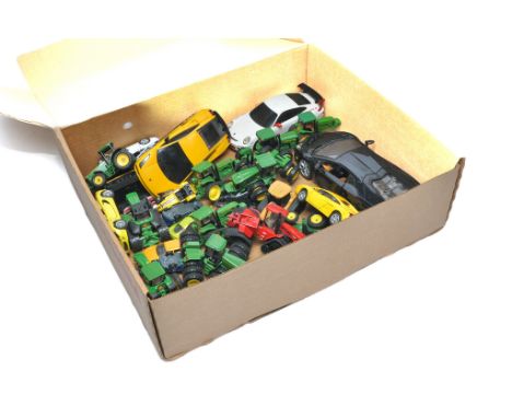 A group of mostly 1/64 diecast Model Tractor issues from Ertl, to include mainly John Deere themes. In addition some diecast 