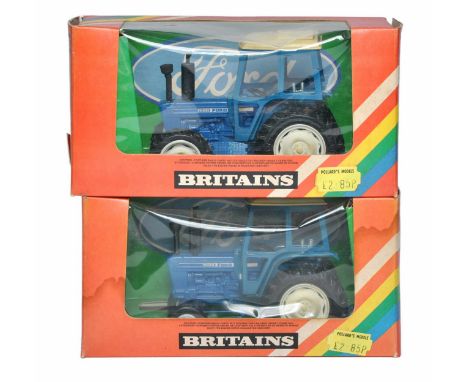 Britains 1/32 Farm Model issues comprising No. 9523 Ford TW20 Tractor (Both modified to 7600 2WD and 4WD). Generally good to 