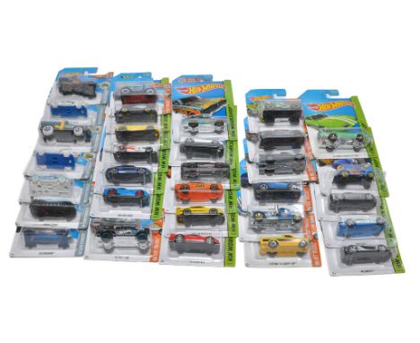 A group of 31 carded Mattel Hot Wheels diecast issues including Workshop, Hot Trucks and Snow Stormers. 