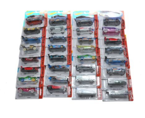 A group of 32 carded Mattel Hot Wheels diecast issues including mostly Race (Track Stars) Series. 