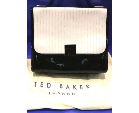 Black and cream Ted Baker handbag with strap and dust cover, L: 26 cm. P&amp;P Group 2 (£18+VAT for the first lot and £3+VAT 