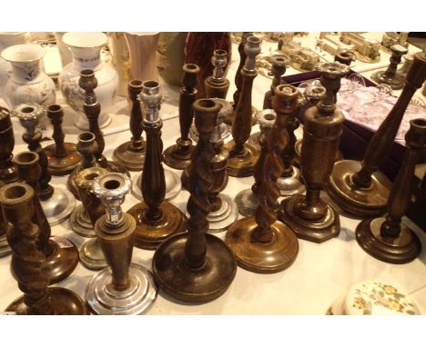 Large quantity of wooden candlestick holders to include barleytwist examples. Not available for in-house P&amp;P, contact Pau