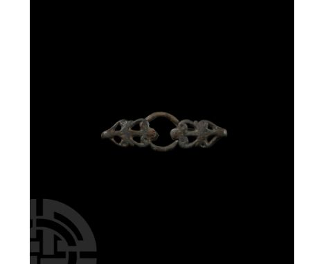 9th-11th century A.D. Composed of a ring and two free-moving foliate style openwork hubs.   24.2 grams, 74 mm (2 7/8 in.). Fr