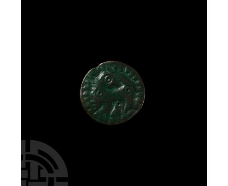 6th-9th century A.D. Displaying a stylised regardant beast standing within a raised geometric border, punched ring-and-dot ey