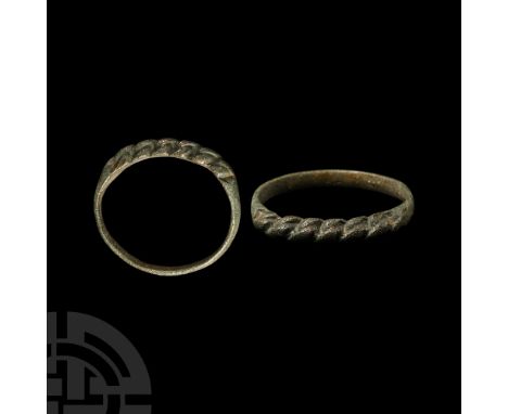Circa 9th-11th century A.D. The slender hoop slightly expanded at the bezel, displaying a faux plaited design.   1.63 grams, 