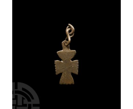 9th-12th century A.D. With remains of notch detailing to the outer edges of the arms, two links of the suspension chain. Cf. 