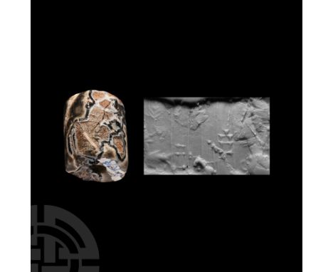 2nd-1st millennium B.C. With incised frieze of figures and a frond or tree. Cf. Teissier, B., Ancient Near Eastern Cylinder S