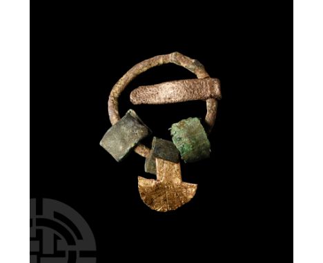 9th-11th century A.D. The round-bodied brooch with articulate flat-section tongue, adorned with three free-running flat-secti