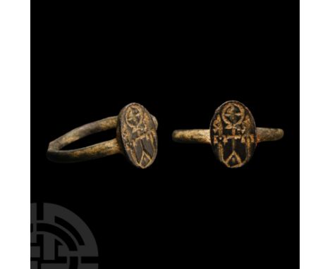 6th century A.D. Facetted hoop supporting an ellipsoid bezel with forked cross (crucifixus dolorosus )supporting a cross-in-r