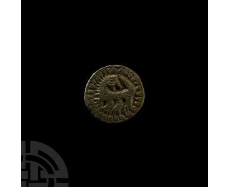 8th-9th century A.D. Comprising a flat-section disc with reserved regardant beast within a pelletted border, pin-lug and catc