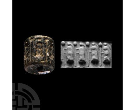 Circa 3rd millennium B.C. With frieze of D-shaped figures and trees between. Cf. Teissier, B., Ancient Near Eastern Cylinder 