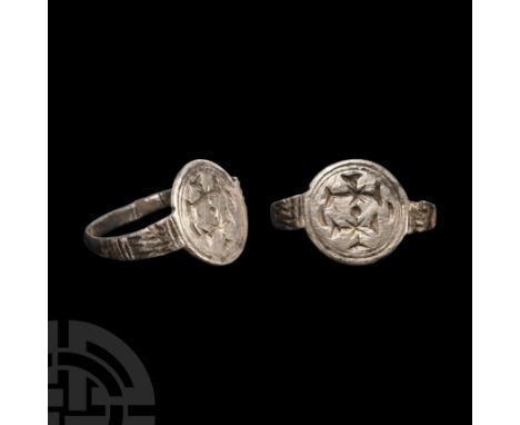 Circa 14th century A.D. Engraved with two crosses fourchée within a circular frame, flanking crescents. See Bequest, F., Cata