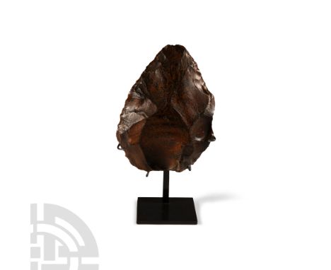 Lower Palaeolithic Period, circa 400,000-200,000 B.P.. Finely knapped bifacial hand axe of triangular form with rounded butt;