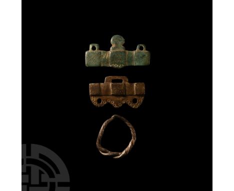 6th-9th century A.D. The ring with a decoratively twisted bezel and overlapping arms; two clasps, one decorated with punched 