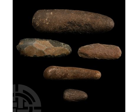 Neolithic Period, 8th-5th millennium B.C. Comprising of two slender knapped stone axes, with a large pecked type (spalled fro