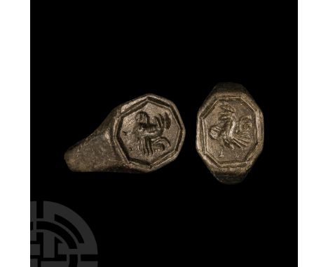 16th-17th century A.D. The hoop expanding to facetted shoulders and an octagonal bezel, engraved with a strutting cockerel wi