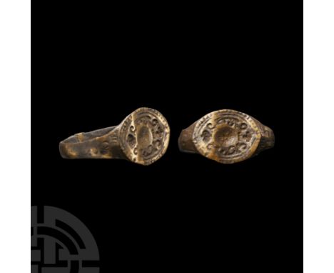 Circa 18th century A.D. With scaphoid bezel, curlicues around a central roundel and pellets to the border. Cf. Chadour, A.B.,