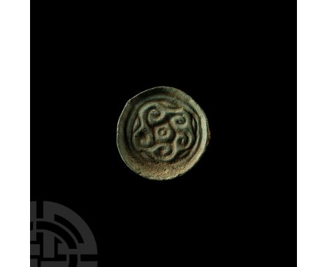5th-6th century A.D. Decorated with five spirals emanating from a central ring-and-dot motif, enclosed within a circumferenti