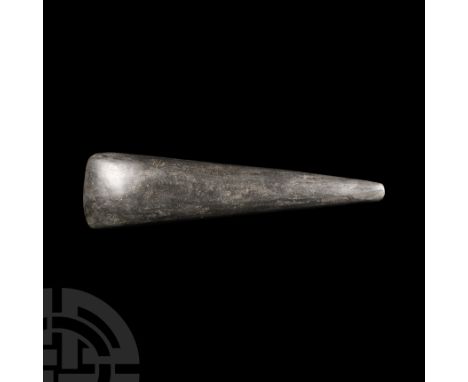 Neolithic, 6th-4th millennium B.C. Of slender, wedge-shaped form with chamfered, convex cutting edge and angled butt.   289 g