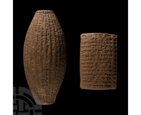 Early 20th century A.D. Made from baked clay, the tablet with pseudo cuneiform to both sides and top; the barrel with pseudo 