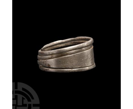 Circa 9th-10th century A.D. With broad hoop tapering to extensions forming a coiled continuation of the hoop; Baltic Semigall