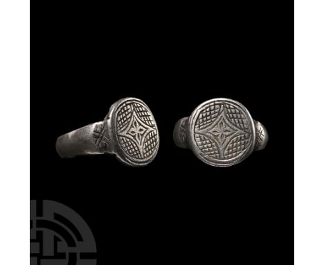 Circa 15th-16th century A.D. With D-section hoop, expanding shoulders with hatching; the round bezel with a central cross mot