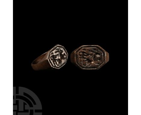14th-16th century A.D. The hoop with chamfered edges, expanding at the shoulders to an octagonal bezel engraved with a huntin