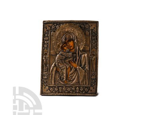 Mid 20th century A.D. The wooden background with an openwork oklad: the Virgin holding the infant Christ, gesturing towards h