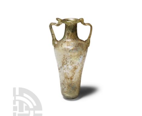 1st-3rd century A.D. Pale green colour with broad rounded shoulder tapering to a rounded base, cylindrical neck and everted r