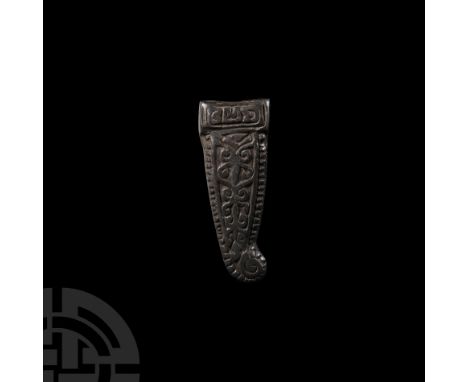 9th-11th century A.D. With pelletted border, reserved scroll decoration, lobe finial and transverse collar at the broad end; 
