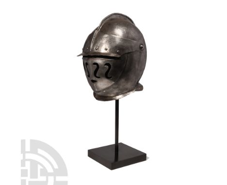 Circa 1620 A.D. Comprising a full face shield with broad wavy bars and a small mouth opening, a wide hinged visor; the visor 