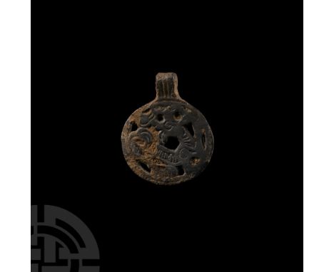 Late 10th-early 11th century A.D. With integral loop, openwork regardant Jellinge style beast with tendrils and border. Cf. K