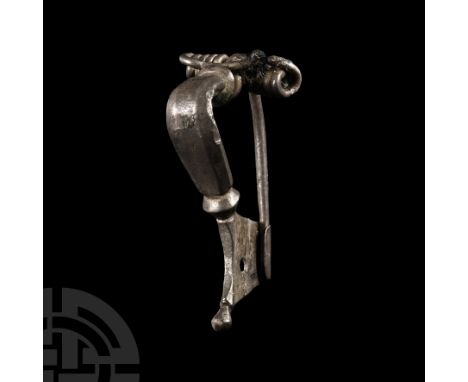 2nd-3rd century A.D. With facetted bow and chord coiled around the rear lug, pin extending to the pierced catchplate with kno