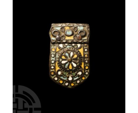 19th century A.D. Tongue-shaped with three loops to reverse; displaying an enamelled rosette against a geometric field and wi