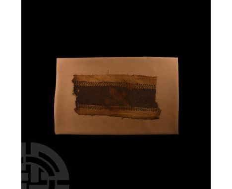 Circa 5th-6th century A.D. The decorative border from a garment (cloak?), wool weaving on linen and purple, tendril pattern; 