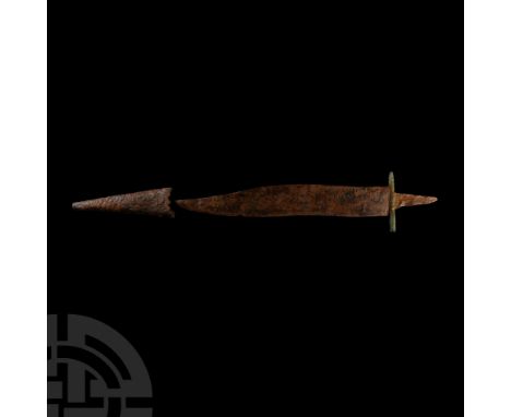 Circa 14th-16th century A.D. The undulating blade with a single cutting edge, guard and tang, together with a chape (belongin