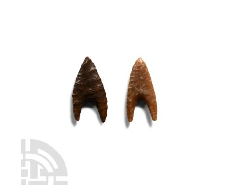 Circa 2nd-7th century A.D. Comprising two finely knapped bifacial, hollow base type arrowheads.   5.12 grams total, 34 mm eac
